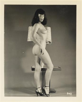 (BETTIE PAGE) A selection of 40 photographs of the Queen of Pinups, comprising 36 vintage photographs, many depicting bondage scenes, a